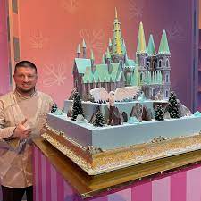 A grand fairy tale castle cake with tall, intricate towers, resembling an enchanted kingdom.