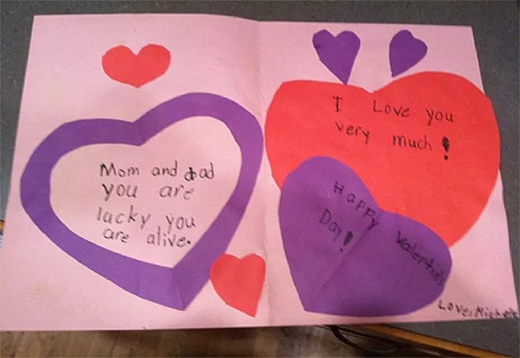 Valentine’s Day card from a child to parents, humorously stating “You are lucky you are alive”