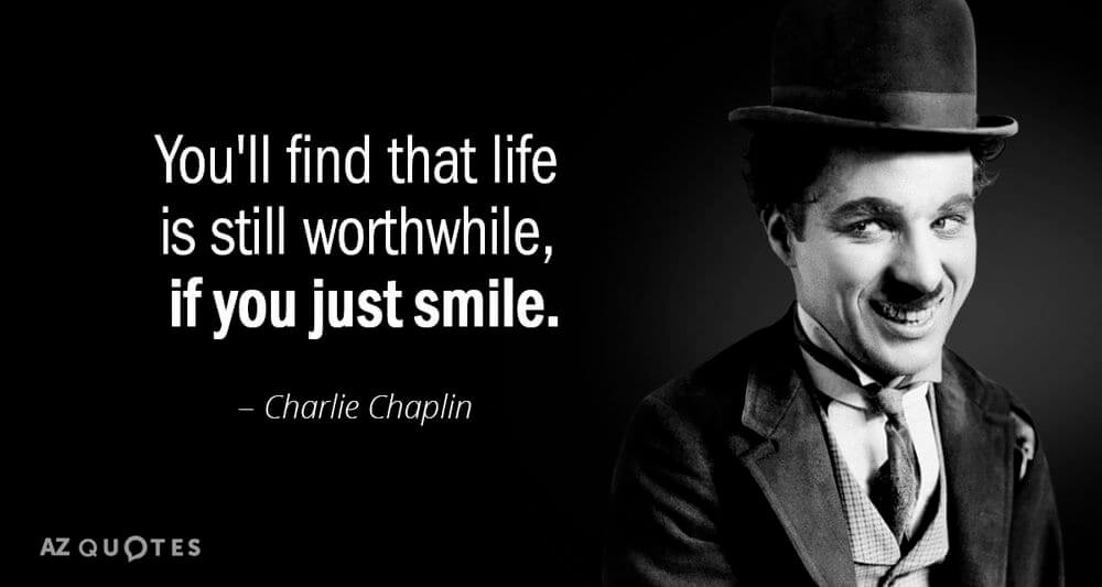 Black and white photograph of Charlie Chaplin smiling in his bowler hat with a quote of his.