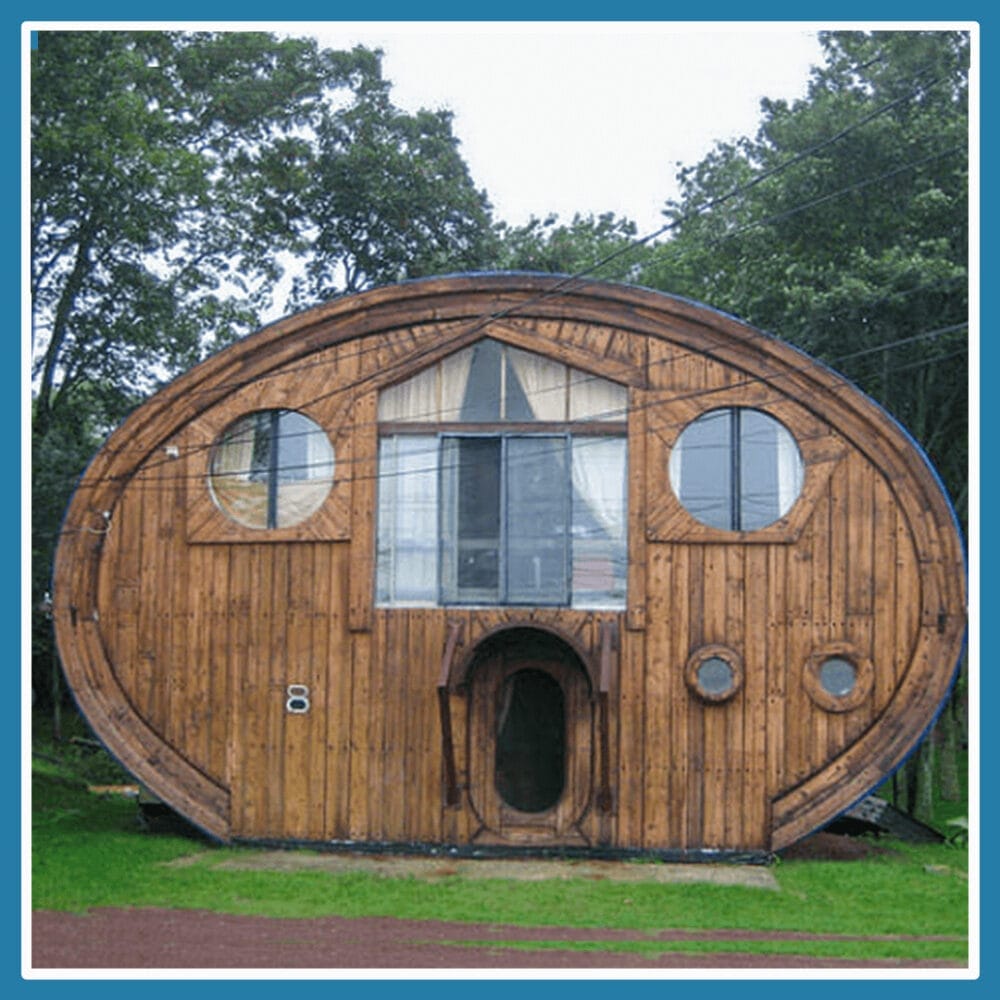 A small round house that appears to have a face as the windows and door appear as the eyes and mouth.